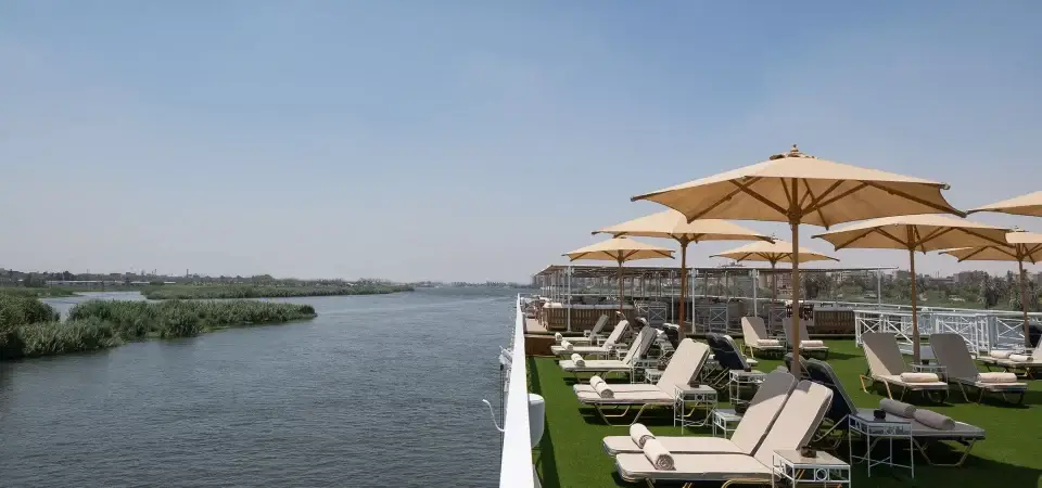 Jaz Regent Nile Cruise sun deck with loungers, parasols, and scenic Nile River views