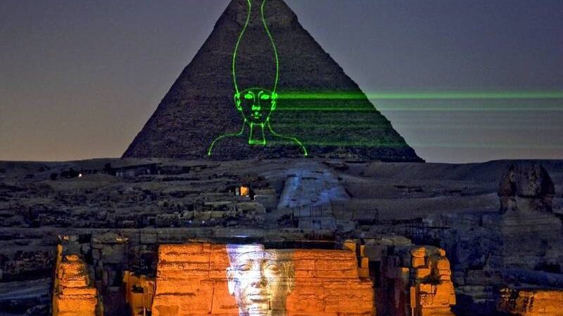 Laser projection of ancient Egyptian pharaoh on the Great Pyramid and the Sphinx during the Giza Sound and Light Show