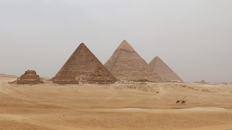 The Giza Pyramids under a hazy sky, a must-see on any tour to Giza Pyramids.