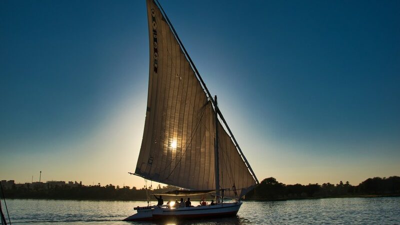 Felucca sailing on the Nile River in Aswan – Aswan Day Tours