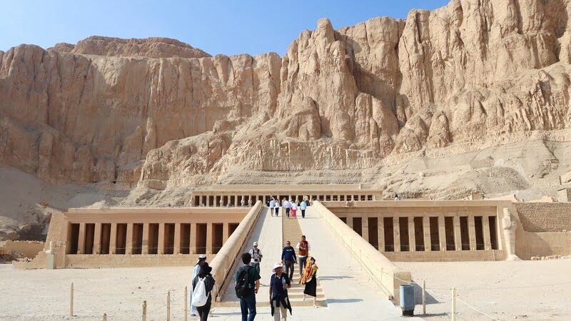 Wide view of Hatshepsut Temple with its grand terraces and columns rising from the desert cliffs in Luxor.